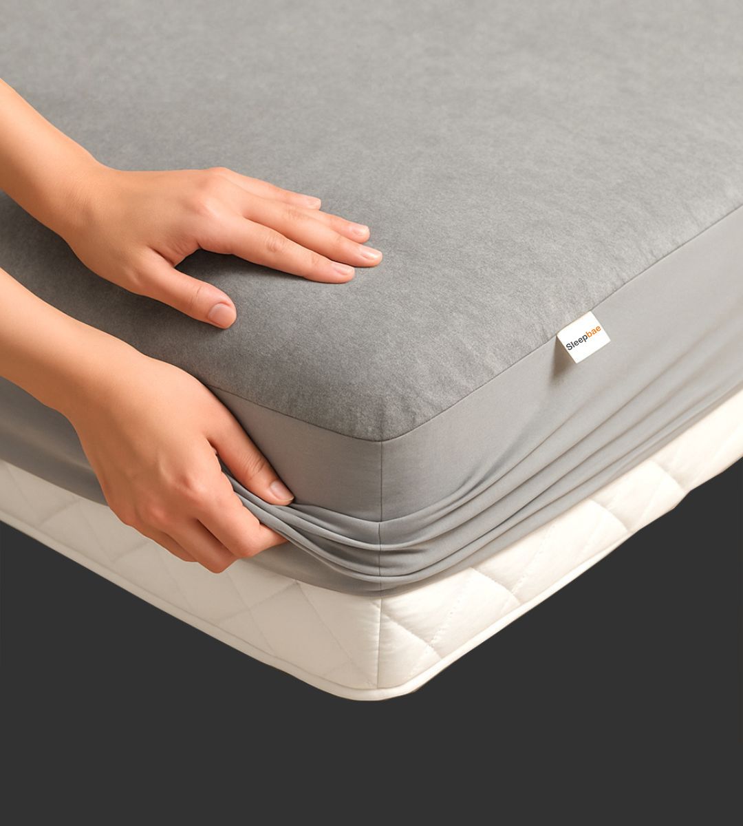 Person Applying Sleepbae Waterproof Mattress Protector